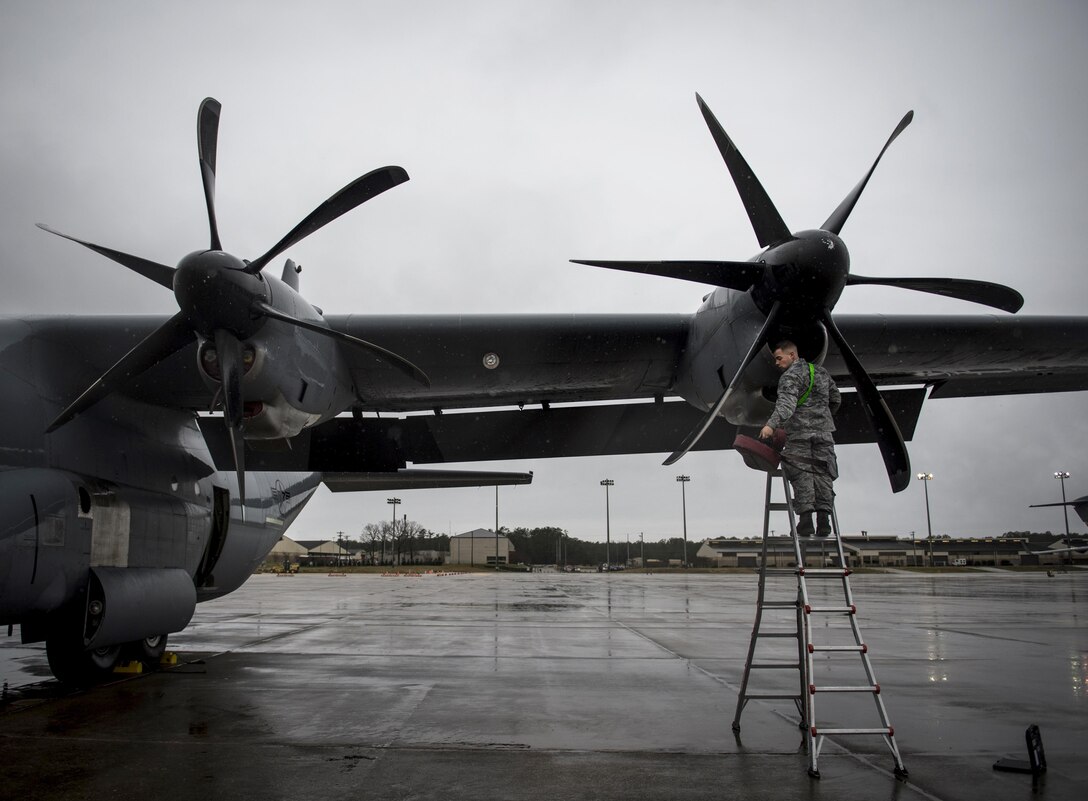 Air Force Senior Airman Jeffrey Erdman conducts a preflight inspection on a C-130J Super Hercules aircraft during “large package week,” on Pope Army Airfield, N.C., Feb. 4, 2016. Erdman is a crew chief assigned to the 19th Aircraft Maintenance Squadron, and the aircraft crew is deployed from Little Rock Air Force Base, Ark. Large package week prepares Army and Air Force units for worldwide crisis and contingency operations. Air Force photo by Staff Sgt. Marianique Santos