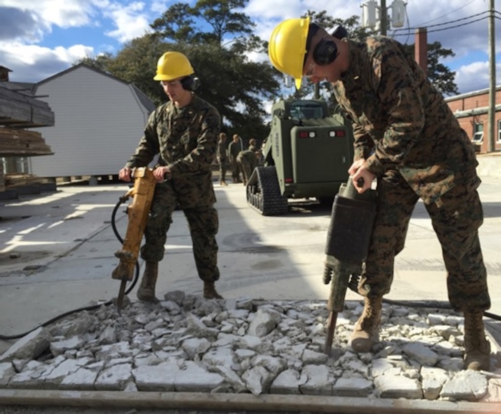 On February 9, 2016 Second Lieutenants Colin M. Savage and William G. Schroers, Marines attached to Combat Engineer Officer course 1-16 (CEO 1-16); use pavement breakers to break apart a concrete slab during a practical application. The pavement breakers are organic to the 260 CFM Air Compressor and provide engineers with a variety of pneumatic tools that aid in excavation and the construction of survivability positions. 
