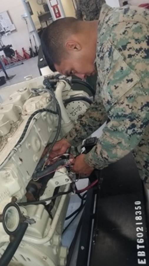 During a Bridge Erection Boat Electrical System practical application Lance Corporal Miguel I. SierraSantana, a Marine attached to Small Craft Mechanics course 2-16 (SCMC 2-16) at Marine Corps Engineer School; removes the wiring connections from the starter and starter solenoid.

