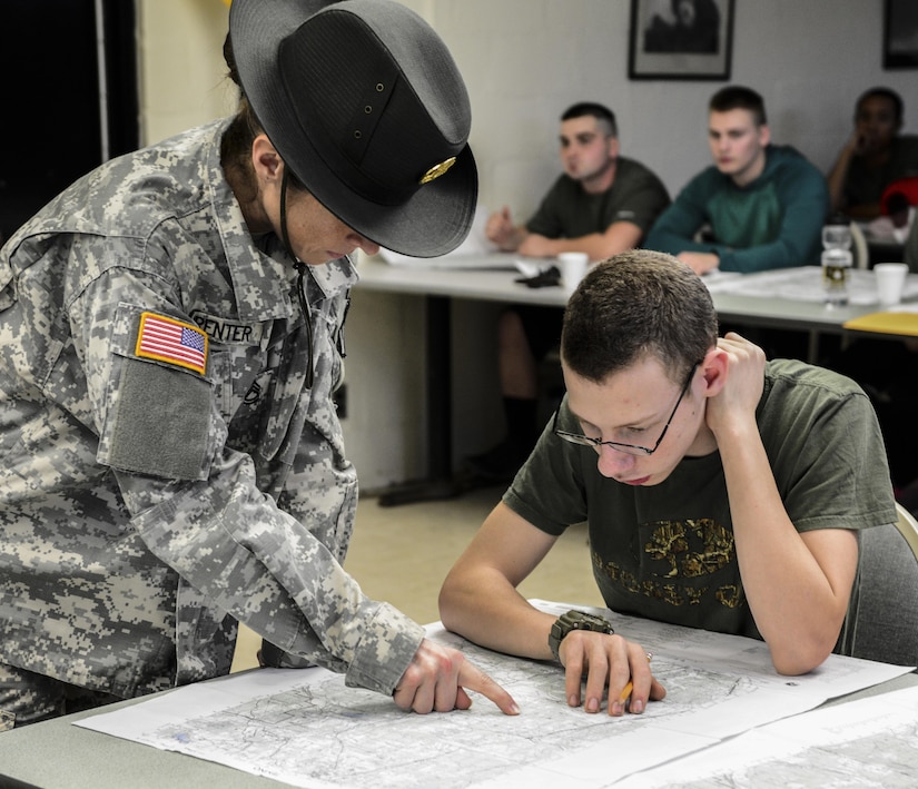 Army Reserve drill sergeant, Sgt. 1st Class Malinda Carpenter, 1st Battalion, 518th Infantry Regiment, 98th Training Division (IET), helps Daniel Forguer identify terrain features on a map of Fort Jackson on Future Soldier day at the Reserve Center in Asheville, N.C., Feb. 20, 2016. Forguer was there to recieve an introduction to Army Warrior tasks before shipping off to basic combat training later in the summer. (U.S. Army photo by Sgt. 1st Class Brian Hamilton)