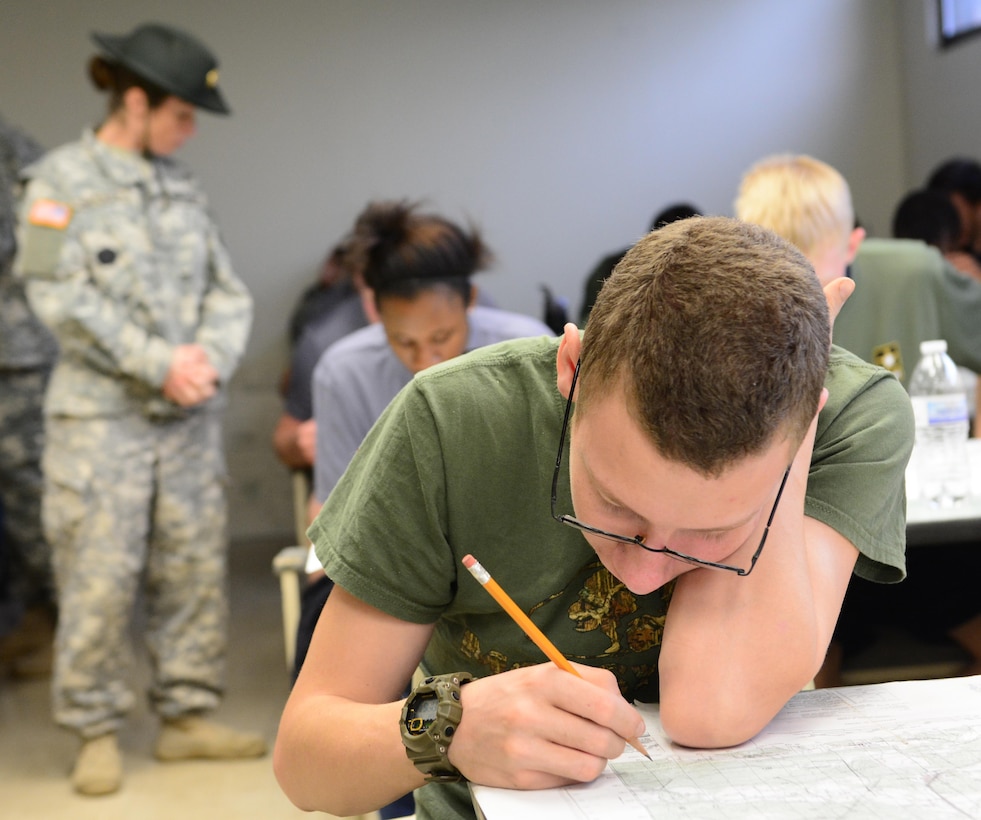 Daniel Forguer searches for terrain features on a map of Fort Jackson during Future Soldier Day hosted by 1st Battalion, 518th Infantry Regiment, 98th Training Division (IET), at the Reserve Center in Asheville, N.C., Feb. 20, 2016. Forguer has not yet enlisted and is undecided on his military occupational specialty but says he is leaning towards becoming a supply specialist with the Army Reserve. (U.S. Army photo by Sgt. 1st Class Brian Hamilton)