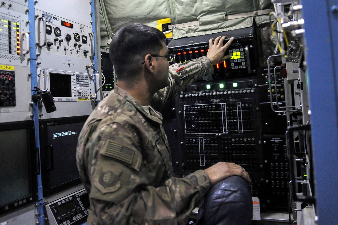 Air Force Staff Sgt. Gabriel Felix runs an operational check of a computer system on an EC-130 Compass Call on Bagram Airfield, Afghanistan, Feb. 10, 2016. Felix is an electronic warfare systems craftsman assigned to the 455th Expeditionary Aircraft Maintenance Squadron. Air Force photo by Tech. Sgt. Nicholas Rau