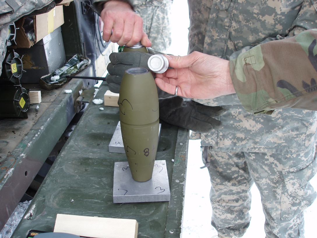 Insensitive Munitions tests by the Cold Regions Research and Engineering Laboratory (CRREL)use fuze simulators on live rounds to initiate the detonations.