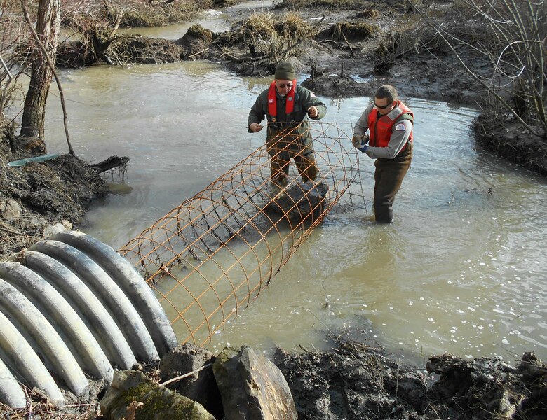 Kyle Kraynak and Jason Cote, park rangers, then built a water flow control device at the culverts entrance. 