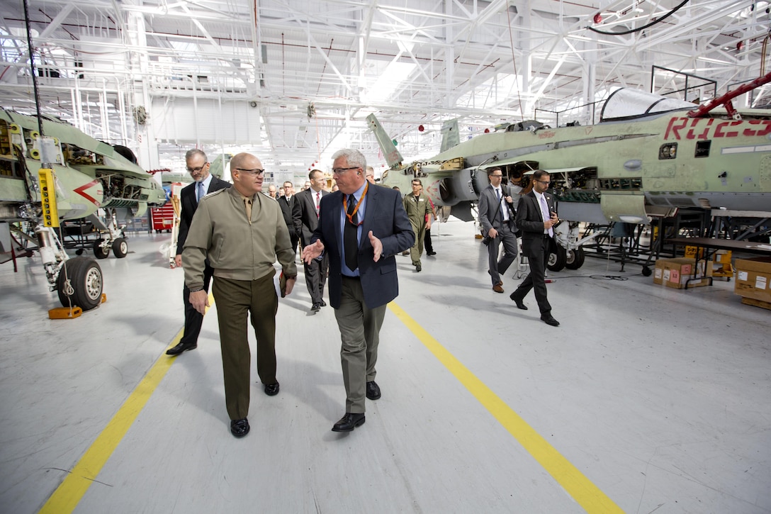 Commandant of the Marine Corps Gen. Robert B. Neller, left, walks alongside a senior executive with Fleet Readiness Center Southwest, at Naval Air Station North Island, Calif., Feb. 19, 2016. Neller toured the depot to observe the FA-18 maintenance repair process. (U.S. Marine Corps photo by Staff Sgt. Gabriela Garcia/Released)