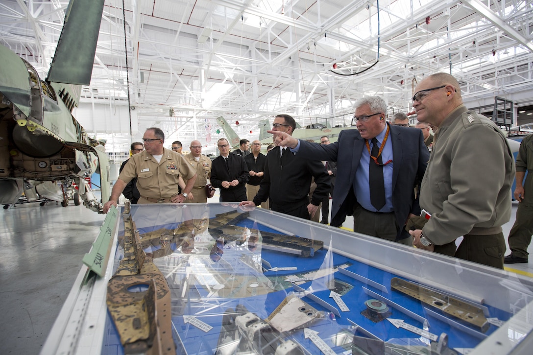 Commandant of the Marine Corps Gen. Robert B. Neller, right, listens to a senior executive with Fleet Readiness Center Southwest, at Naval Air Station North Island, Calif., Feb. 19, 2016. Neller toured the depot to observe the FA-18 maintenance repair process. (U.S. Marine Corps photo by Staff Sgt. Gabriela Garcia/Released)