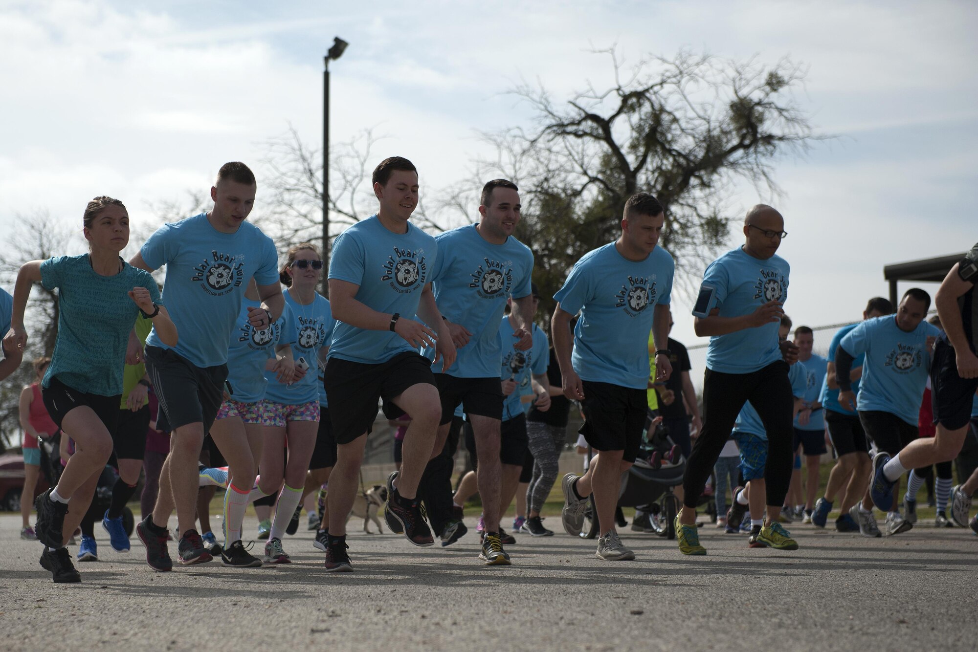 Participants begin a 5K during the Polar Bear Plunge event at Goodfellow Recreation Camp, San Angelo, Texas, Feb. 20, 2016. The participant with the fastest 5K time was presented a Polar Bear Plunge trophy. (U.S. Air Force photo by Airman 1st Caelynn Ferguson/Released)

