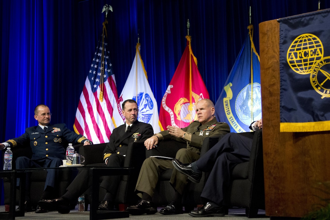 From left, Vice Commandant of the Coast Guard Vice Adm. Charles D. Michel, Chief of Naval Operations Adm. John M. Richardson, listen to Commandant of the Marine Corps Gen. Robert B. Neller, during the WEST 2016 Conference at the San Diego Convention Center, Calif., Feb. 19, 2016. Michel, Richardson, and Neller attended WEST as the joint chief speakers during the luncheon town hall. (U.S. Marine Corps photo by Staff Sgt. Gabriela Garcia/Released)