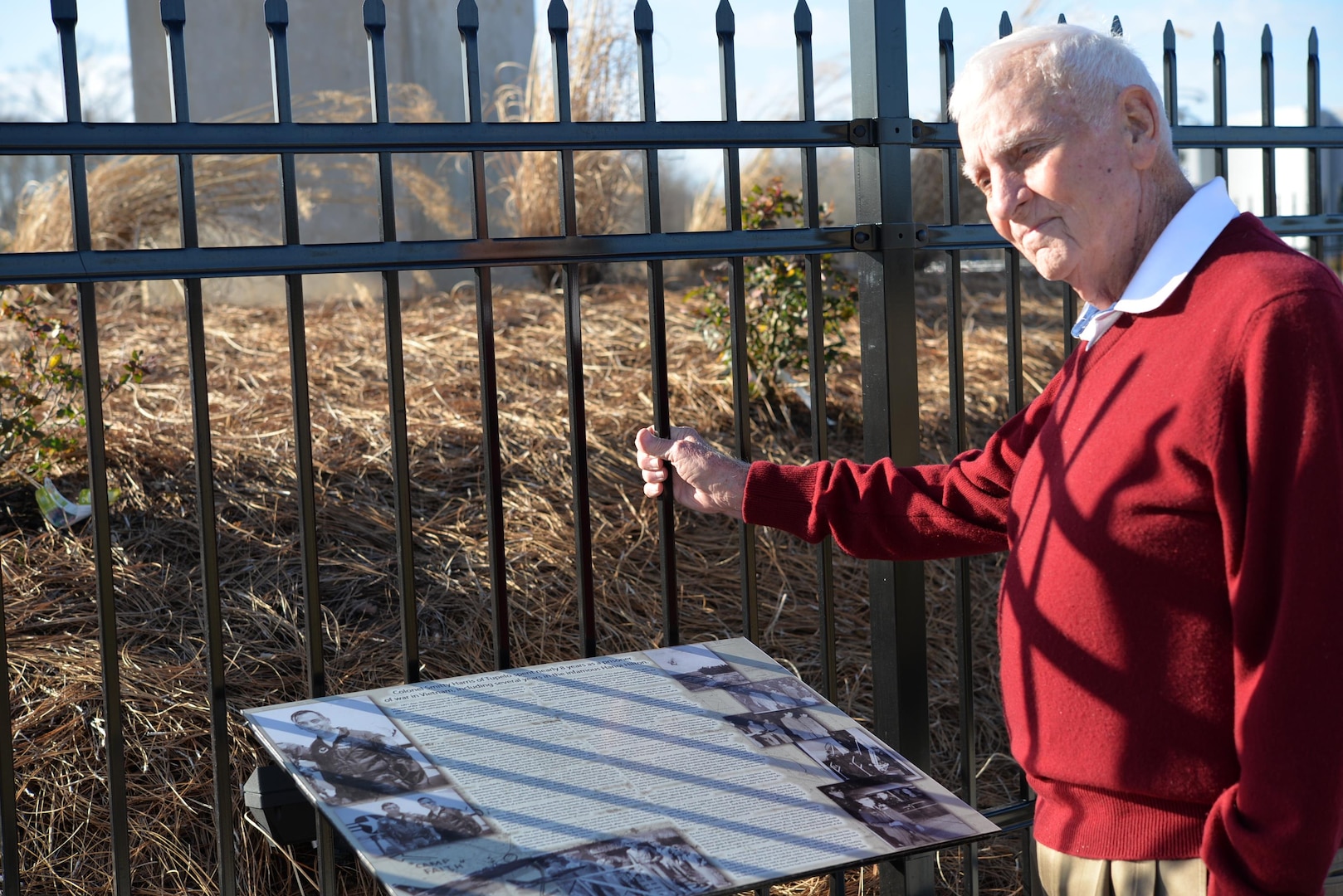 Retired Air Force Col. Carlyle "Smitty" Harris reflects on his time as a prisoner of war in North Vietnam while looking at a plaque honoring his family at the Tupelo (Miss.) Veterans Park Feb. 3, 2016. Harris' spouse Louise faced a myriad of obstacles during the time her husband spent in captivity during the Vietnam War but prevailed in part due to her resilience.  