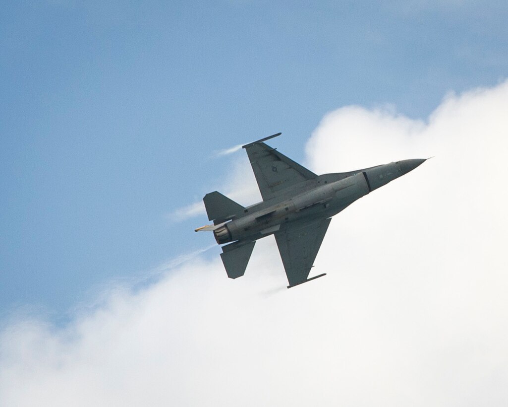A U.S. Air Force F-16C Fighting Falcon from the 35th Fighter Wing, Misawa Air Base, Japan, performs an aerial demonstration during the Singapore International Airshow, at Changi International Airport, Singapore, Feb. 21, 2016. The show was an opportunity for the U.S. to demonstrate flexible combat capabilities and to deter adversaries, while reassuring allies and partners. (U.S. Air Force photo by Capt. Raymond Geoffroy/Released)