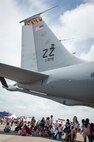 Guests enjoy shade provided by a U.S. Air Force KC-135 Stratotanker during the Singapore International Airshow, at Changi International Airport, Singapore, Feb. 21, 2016. The show is focused on building strong relations between Singapore, U.S. and the international community. (U.S. Air Force photo by Capt. Raymond Geoffroy/Released)
