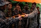 Staff Sgt. Levi Wood, survival, evasion, resistance and escape instructor assigned to the 353rd Combat Training Squadron, shares star fruit with Japan Air Self-Defense Force airmen during a jungle survival workshop Feb. 16, 2016, at Andersen Air Force Base, Guam. Exercise Cope North 16 includes 22 total flying units and nearly 3,000 personnel from six countries and continues the growth of strong, interoperable and beneficial relationships within the Indo-Asia-Pacific region through integration of airborne and land-based command and control assets. (U.S. Air Force photo by Staff Sgt. Alexander W. Riedel/Released)