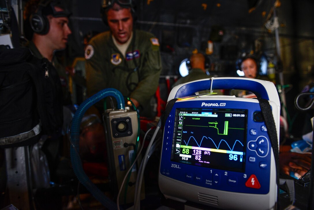 Staff Sgt. Matthew Flowers, an aeromedical evacuation technician with the 18th Aeromedical Evacuation Squadron, performs simulated CPR aboard a U.S. Air Force C-130 Hercules Feb. 15, 2016, during an expeditionary medical support exercise above the Pacific Ocean near Guam. Exercise Cope North 16 enhances humanitarian assistance and disaster relief crisis response capabilities between six nations and lays the foundation for regional cooperation during real-world contingencies in the Indo-Asia-Pacific region. (U.S. Air Force photo by Staff Sgt. Alexander W. Riedel/Released)