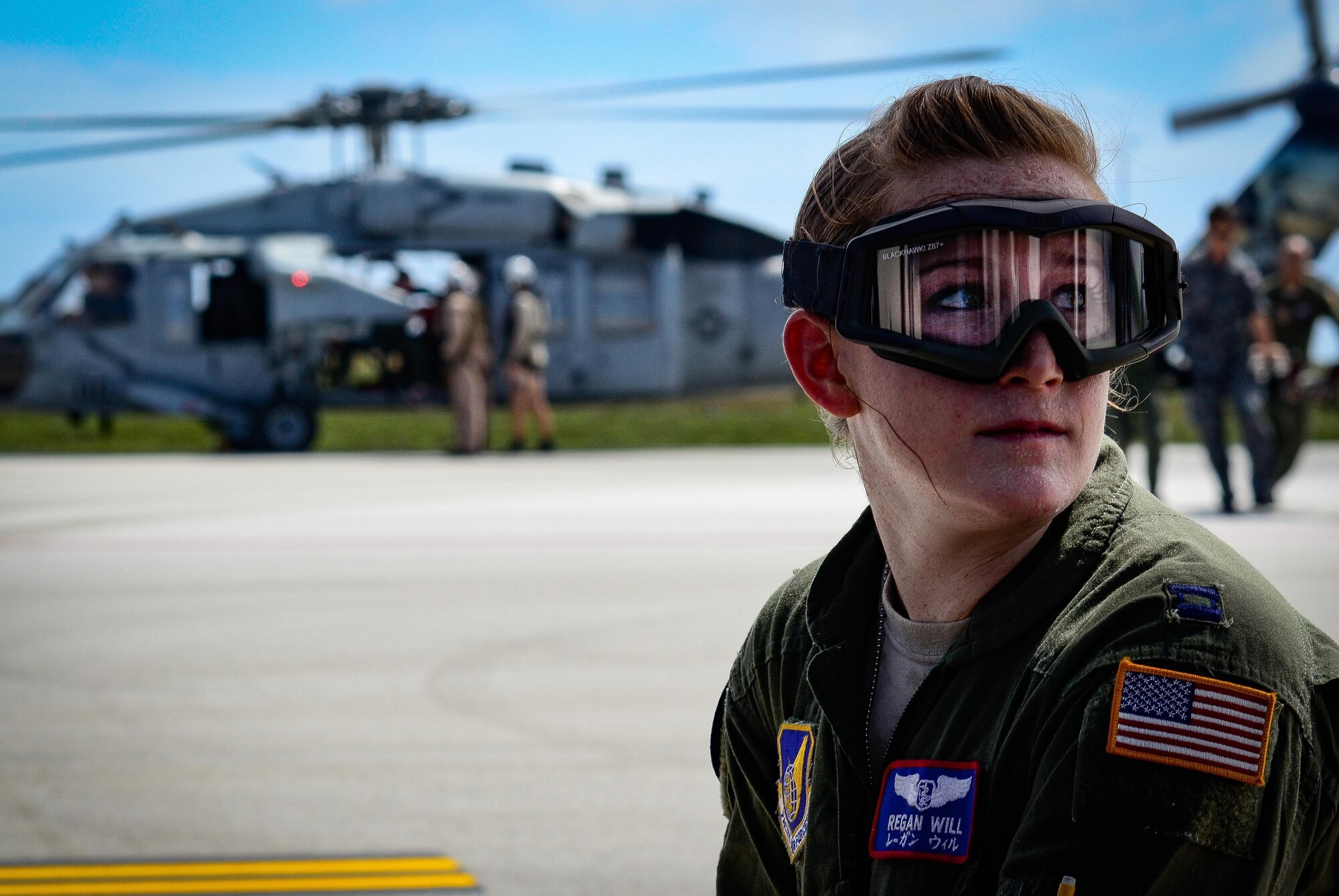 U.S. Air Force Capt. Regan Will, a flight nurse with the 18th Aeromedical Evacuation Squadron, listens to instructions during a medical patient transfer exercise Feb. 17, 2016, at Andersen Air Force Base, Guam. Exercise Cope North 16 enhances humanitarian assistance and disaster relief crisis response capabilities between six nations and lays the foundation for regional cooperation during real-world contingencies in the Indo-Asia-Pacific region. The MH-60S is assigned to Helicopter Sea Combat Squadron 25. The team conducted a simulated search and rescue exercise off the coast of Guam. (U.S. Air Force photo by Staff Sgt. Alexander W. Riedel/Released)