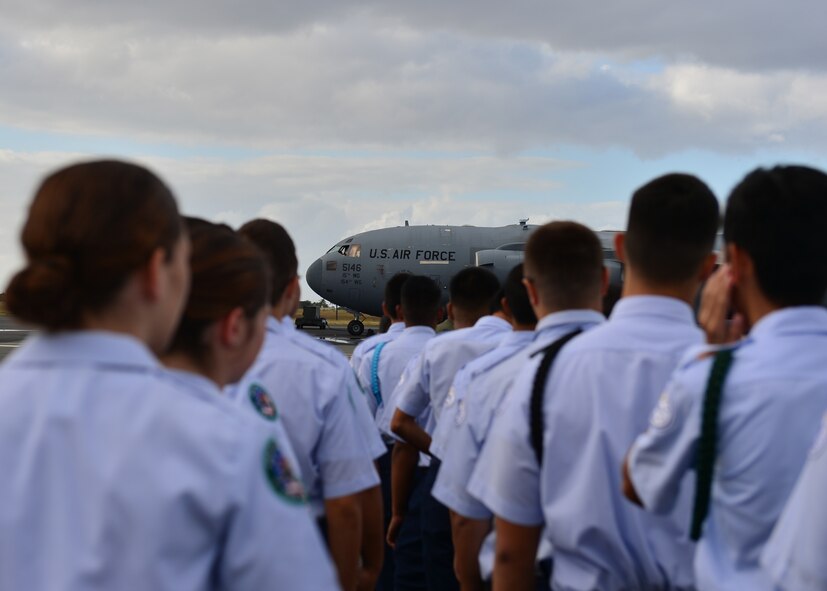Students from Aiea High School’s Air Force Junior Reserve Officer Training Corps prepare to walk across the flight line on Joint Base Pearl Harbor-Hickam, Hawaii, Feb 18, 2016. The 30 JROTC students toured a C-17 Globemaster III and visited the 647th Explosive Ordnance Disposal unit and the 647th Security Forces Squadron's military working dog kennel during their visit to JBPHH. (U.S. Air Force photo by Tech. Sgt. Aaron Oelrich/Released) 