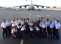 Students from Aiea High School’s Air Force Junior Reserve Officer Training Corps pose for a group photo on Joint Base Pearl Harbor-Hickam, Hawaii, Feb 18, 2016. The 30 JROTC students toured a C-17 Globemaster III and visited the 647th Explosive Ordnance Disposal unit and the 647th Security Forces Squadron's military working dog kennel during their visit to JBPHH. (U.S. Air Force photo by Tech. Sgt. Aaron Oelrich/Released) 