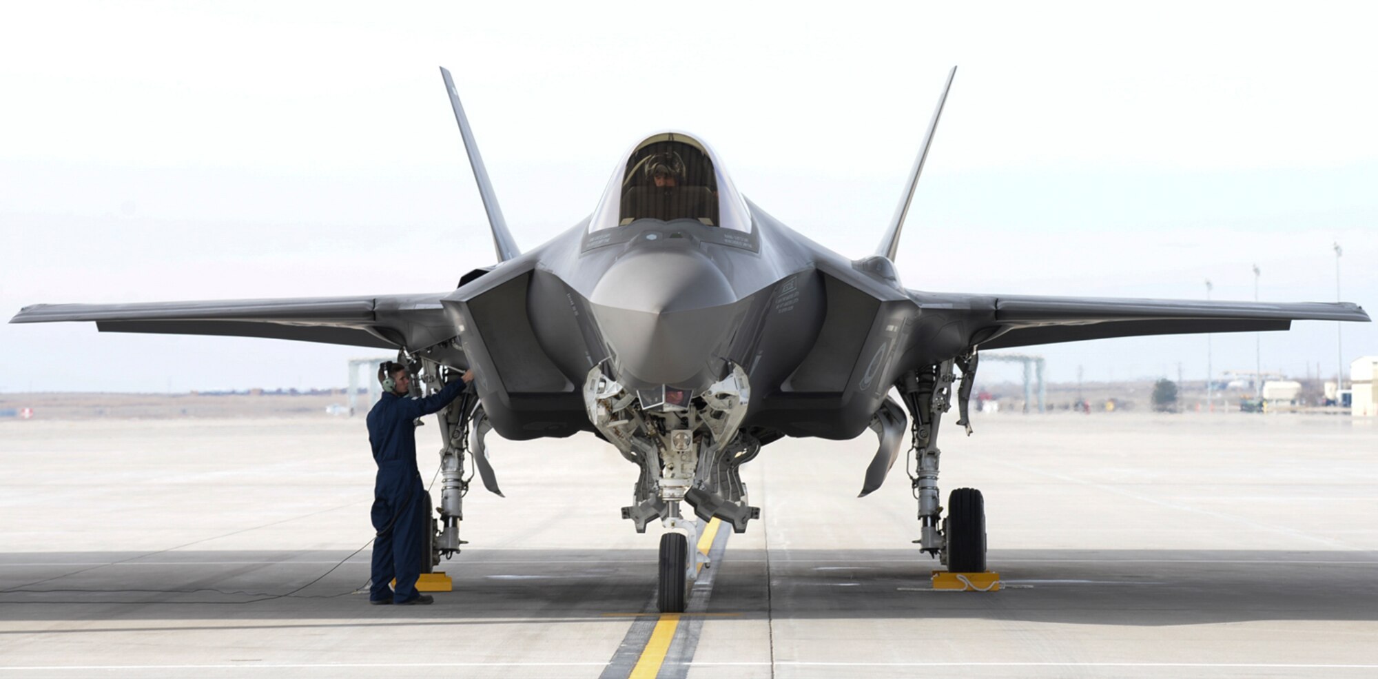 An airman prepares an F-35A for take-off at Mountain Home Air Force Base, Idaho, Feb. 12, 2016. The aircraft is here to validate its capability to deploy as part of an operational test by the 31st Test and Evaluation Squadron from Edwards AFB, Calif. (U.S. Air Force photo by Airman 1st Class Jessica H. Evans/RELEASED)