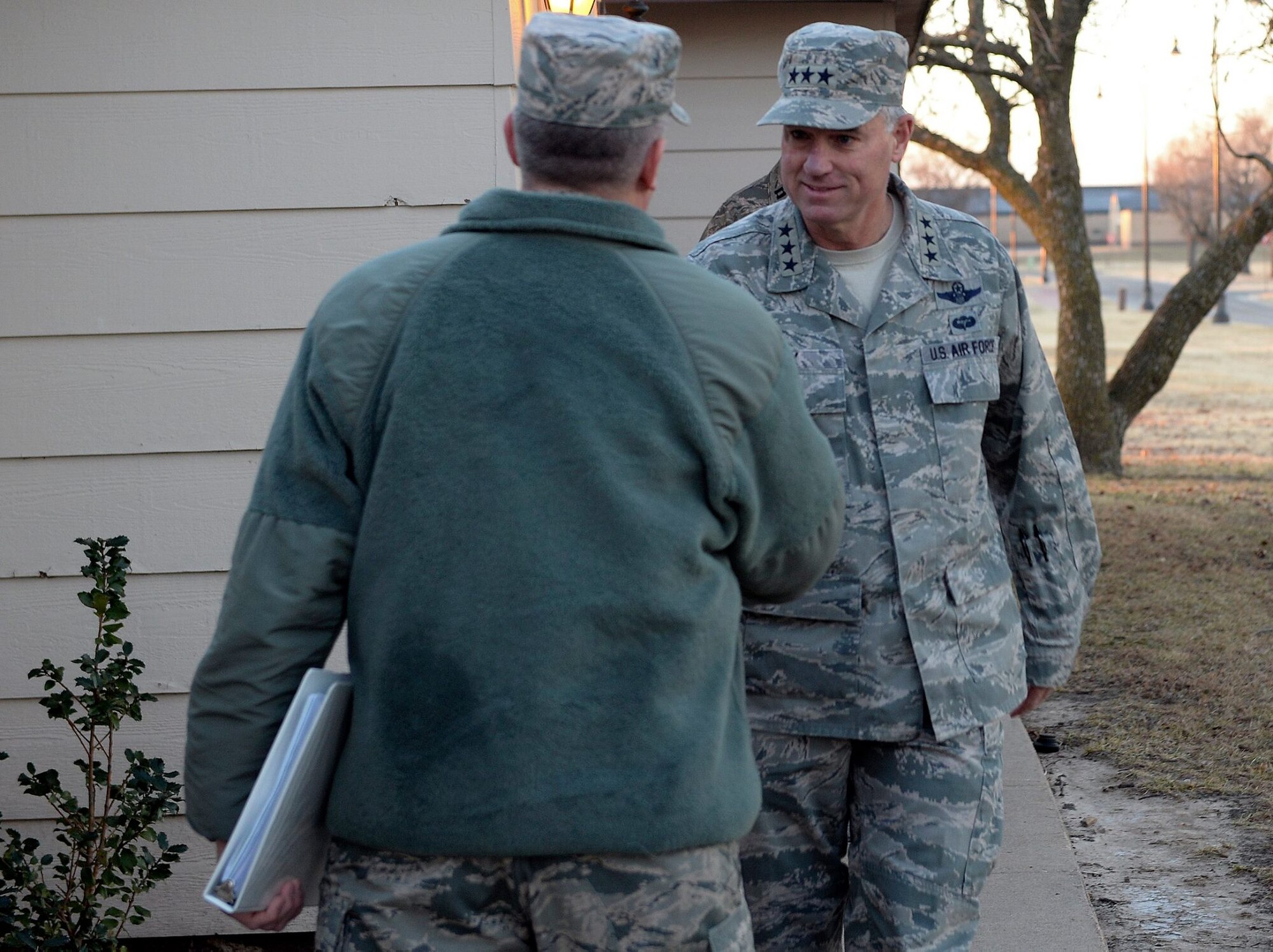 Lt. Gen. Samuel Cox, 18th Air Force commander, meets Col. Albert Miller, 22nd Air Refueling Wing commander, during a visit to McConnell Air Force Base, Kan., Feb. 16, 2016. This is Cox's first visit to McConnell since taking command of the 18th Air Force. Cox toured the base and met with Airmen who demonstrated various parts of the mission here. (U.S. Air Force photos/Senior Airman Colby L. Hardin)