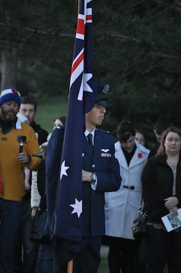 Capt. Nathaniel Beer, 384th Air Refueling Squadron pilot, carries the Australian flag, April 25, 2015, in Denver, Beer performs with the Australian color guard during the annual Anzac day in Denver. Anzac day is celebrated in Australia and New Zealand to honor those who served and died in all wars. (Courtesy Photo)