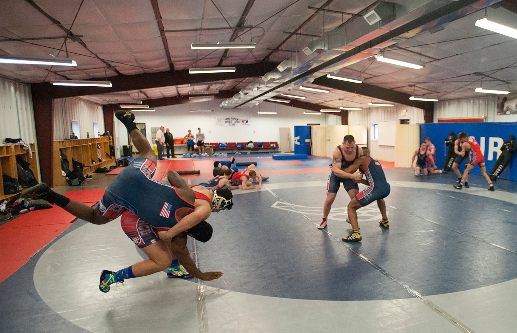 Staff Sgt. Jeffrey Zastrow, 96th Medical Group (middle facing out) and the U.S. Air Force Wrestling Team practices in the fight house at Joint Base McGuire-Dix-Lakehurst, N.J., during their six-week training and trial camp. Twenty-one Airmen came from around the world to participate. By the end of the camp, Zastrow and 12 others were selected. (U.S. Air Force photo by Christian DeLuca)