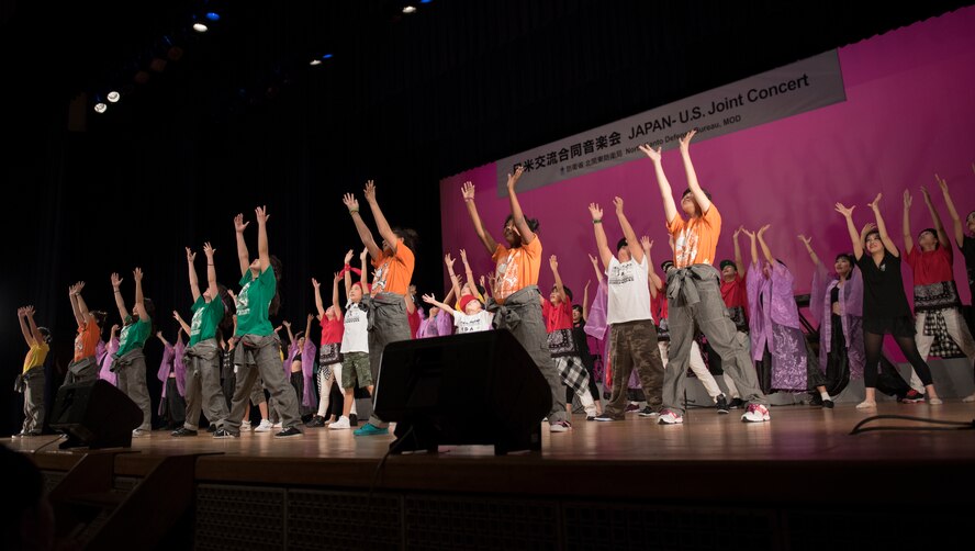 Fumi Dance Academy members hold a pose for applause during the Japan-U.S. Joint Concert at Kotori Hall in Akishima, Tokyo, Japan, Feb. 20, 2016. In addition to the Fumi Dance Academy, Yokota Dance Company performed as well. (U.S. Air Force photo by Staff Sgt. Michael Washburn/Released)