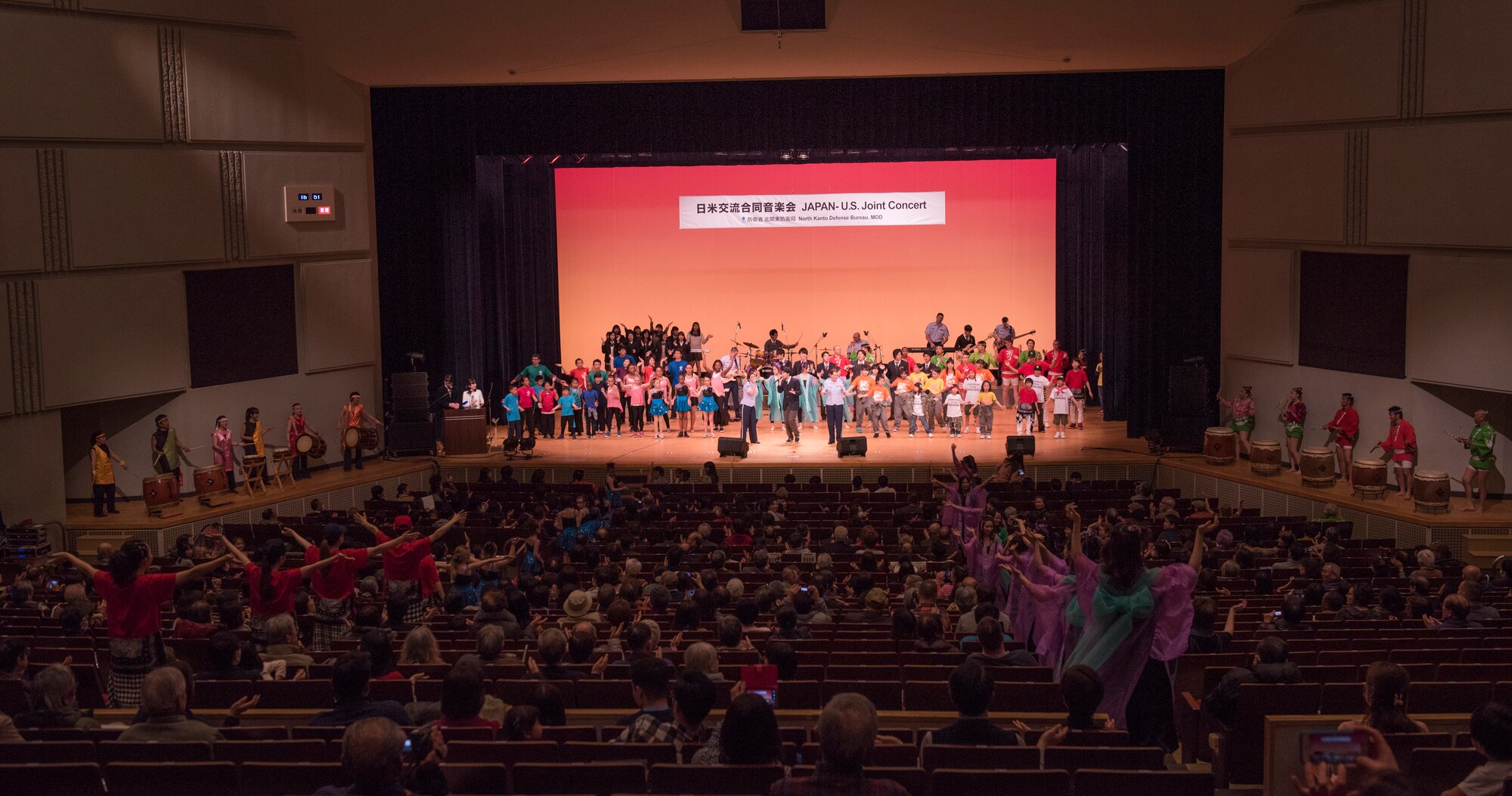 The Air Force Band of the Pacific-Asia, Pacific Trends, performs one last song with all the performers during the Japan-U.S. Joint Concert at Kotori Hall in Akishima, Tokyo, Japan, Feb. 20, 2016. The North Kanto Defense Bureau hosted the event to help foster better relationships between Japanese and U.S. members. (U.S. Air Force photo by Staff Sgt. Michael Washburn/Released)
