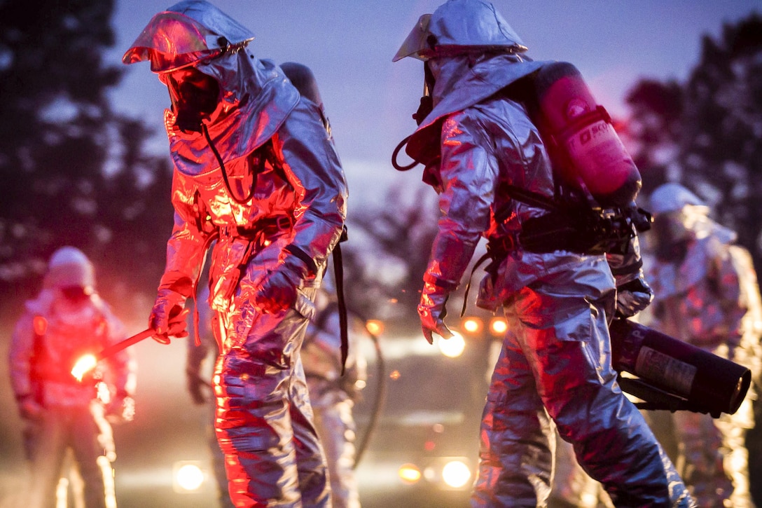 Marines prepare to light a fire during a controlled burn training exercise on Marine Corps Air Station Beaufort, S.C., Feb. 17, 2016. The exercise involved burning jet fuel around a model jet to give Marines a realistic experience of putting out an aircraft fire. Marine Corps Photo by Lance Cpl. Jonah Lovy