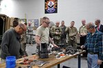 Maj. Gen. Flem B. Walker, Jr., the Deputy Chief of Staff, Logistics (G-4) for U.S. Army Forces Command, observes students training at the Sustainment Training Center, located in Johnston, Iowa. Walker toured the Iowa National Guard facility during a recent visit to Camp Dodge.