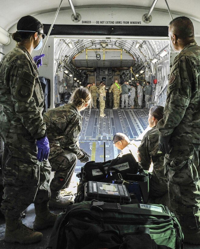 Airmen prepare to load equipment used to save the life of a NATO service member onto an aeromedical evacuation transport on Bagram Airfield, Afghanistan, Feb. 18, 2016. Air Force photo by Tech. Sgt. Nicholas Rau