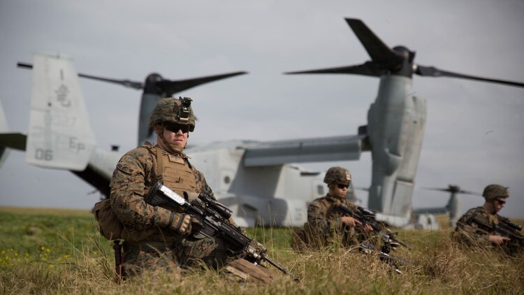 Marines with Charlie Company, Battalion Landing Team 1st Battalion, 5th Marines, 31st Marine Expeditionary Unit, secure their perimeter after disembarking from MV-22B Ospreys at Ie Shima Training Facility, Okinawa, Japan, Feb. 12, 2016. Marines and sailors with the 31st MEU flew from the USS Bonhomme Richard to Ie Shima for a vertical assault as part of amphibious integration training with the Navy ships of the Bonhomme Richard Amphibious Ready Group. The 31st MEU is currently deployed to the Asia-Pacific region. 