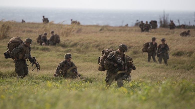 Marines with Charlie Company, Battalion Landing Team 1st Battalion, 5th Marines, 31st Marine Expeditionary Unit, move out after disembarking from MV-22B Ospreys at Ie Shima Training Facility, Okinawa, Japan, Feb. 12, 2016. Marines and sailors with the 31st MEU flew from the USS Bonhomme Richard to Ie Shima for a vertical assault as part of amphibious integration training with the Navy ships of the Bonhomme Richard Amphibious Ready Group. The 31st MEU is currently deployed to the Asia-Pacific region. 