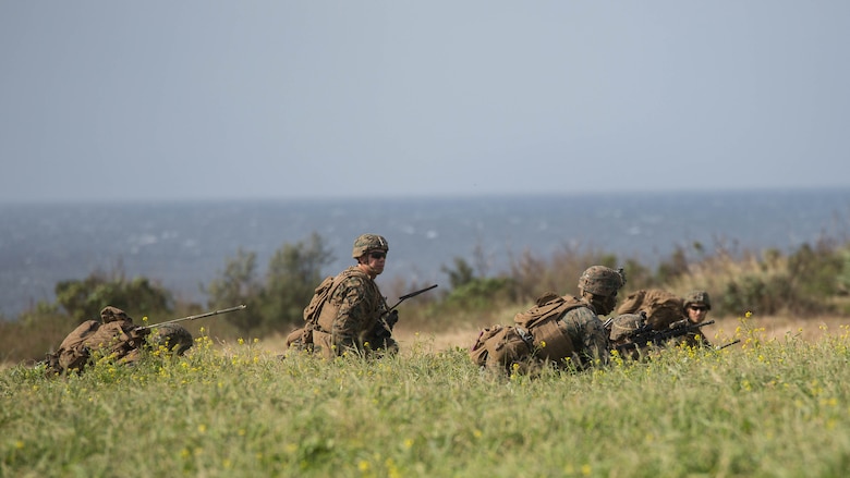 Marines with Charlie Company, Battalion Landing Team 1st Battalion, 5th Marines, 31st Marine Expeditionary Unit, prepare to move out after disembarking from MV-22B Ospreys at Ie Shima Training Facility, Okinawa, Japan, Feb. 12, 2016. Marines and sailors with the 31st MEU flew from the USS Bonhomme Richard to Ie Shima for a vertical assault as part of amphibious integration training with the Navy ships of the Bonhomme Richard Amphibious Ready Group. The 31st MEU is currently deployed to the Asia-Pacific region. 