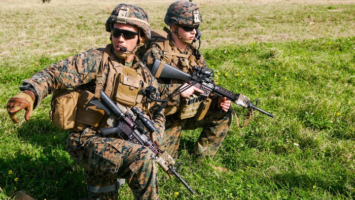 1st Lt. Patrick Nugent, a platoon commander with Charlie Company, Battalion Landing Team 1st Battalion, 5th Marines, 31st Marine Expeditionary Unit, directs his Marines into their positions during an assault on the airfield at the Ie Shima Training Facility, Okinawa, Japan, Feb. 12, 2016. Marines and sailors with the 31st MEU flew from the USS Bonhomme Richard to Ie Shima for a vertical assault as part of amphibious integration training with the Navy ships of the Bonhomme Richard Amphibious Ready Group. The 31st MEU is currently deployed to the Asia-Pacific region. Nugent is a Cleveland native. 