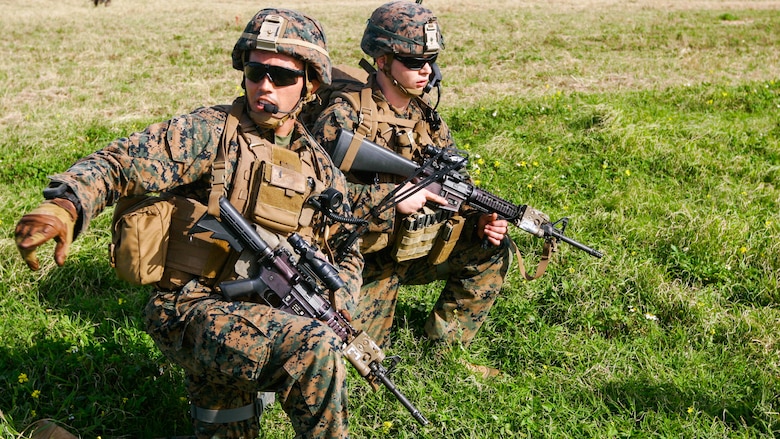 1st Lt. Patrick Nugent, a platoon commander with Charlie Company, Battalion Landing Team 1st Battalion, 5th Marines, 31st Marine Expeditionary Unit, directs his Marines into their positions during an assault on the airfield at the Ie Shima Training Facility, Okinawa, Japan, Feb. 12, 2016. Marines and sailors with the 31st MEU flew from the USS Bonhomme Richard to Ie Shima for a vertical assault as part of amphibious integration training with the Navy ships of the Bonhomme Richard Amphibious Ready Group. The 31st MEU is currently deployed to the Asia-Pacific region. Nugent is a Cleveland native. 