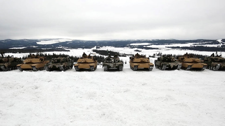 U.S. Marine Corps M1 Abrams tanks and Norwegian Leopard 2A4 Tanks rest in a field after training in Rena, Norway, Feb. 17, 2016. The Marines and Norwegian Army are working together as part of Exercise Cold Response, a joint NATO and allied country exercise comprised of 12 countries and approximately 16,000 troops. The U.S. European Command appreciates the opportunity for taking part in such a large multinational exercise at the invitation of our Norwegian Allies; and we are especially thankful for the chance to put our skills to the test in unique cold weather conditions.