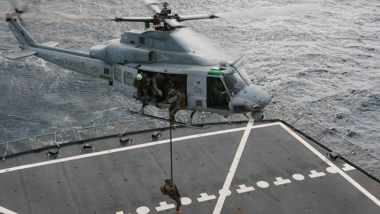 Reconnaissance Marines with Maritime Raid Force, 31st Marine Expeditionary Unit, fast-rope to the deck of the USNS Rappahannock from a UH-1Y Huey belonging to Marine Medium Tiltrotor Squadron, 31st MEU, during a visit, board, search and seizure training exercise Feb. 17, 2016. The VBSS was conducted as part of the MEU's amphibious integration training with the Navy ships of the Bonhomme Richard Amphibious Ready Group. The Marines and sailors of the 31st MEU are currently on their spring deployment to the Asia-Pacific region. 