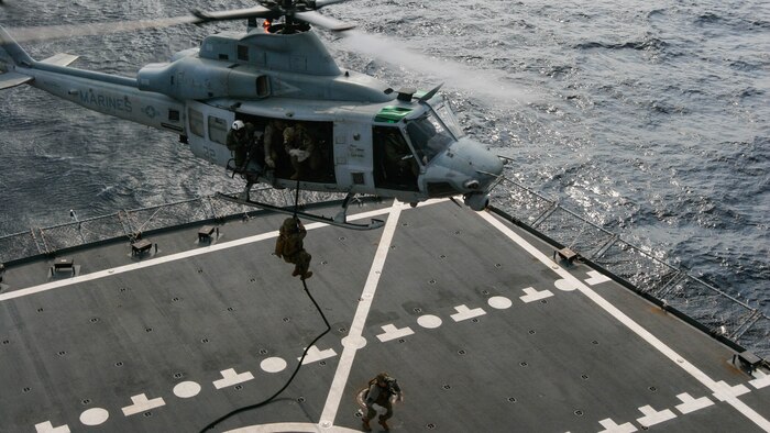 Reconnaissance Marines with Maritime Raid Force, 31st Marine Expeditionary Unit, fast-rope to the deck of the USNS Rappahannock from a UH-1Y Huey belonging to Marine Medium Tiltrotor Squadron, 31st MEU, during a visit, board, search and seizure training exercise Feb. 17, 2016. The VBSS was conducted as part of the MEU's amphibious integration training with the Navy ships of the Bonhomme Richard Amphibious Ready Group. The Marines and sailors of the 31st MEU are currently on their spring deployment to the Asia-Pacific region. 