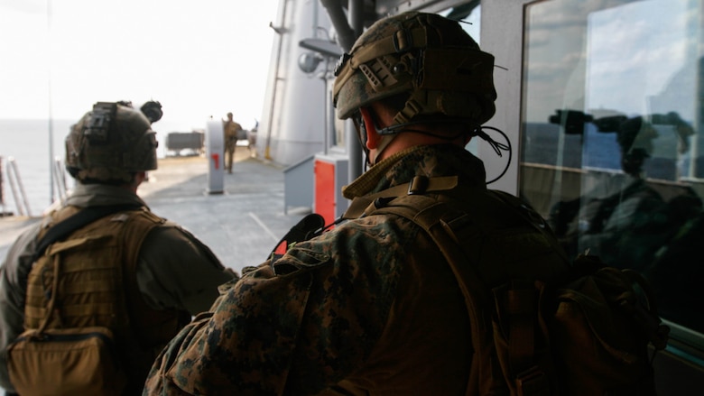 Two reconnaissance Marines with Maritime Raid Force, 31st Marine Expeditionary Unit, work to secure the upper decks of the USNS Rappahannock during a visit, board, search and seizure training exercise Feb. 17, 2016. The VBSS was conducted as part of the MEU's amphibious integration training with the Navy ships of the Bonhomme Richard Amphibious Ready Group. The Marines and sailors of the 31st MEU are currently on their spring deployment to the Asia-Pacific region.