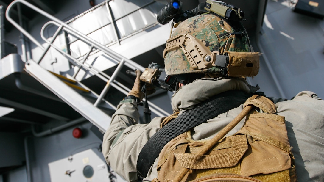 A reconnaissance Marine with Maritime Raid Force, 31st Marine Expeditionary Unit, works to ensure the upper decks of the USNS Rappahannock remain clear during a visit, board, search and seizure training exercise Feb. 17, 2016. The VBSS was conducted as part of the MEU's amphibious integration training with the Navy ships of the Bonhomme Richard Amphibious Ready Group. The Marines and sailors of the 31st MEU are currently on their spring deployment to the Asia-Pacific region. 