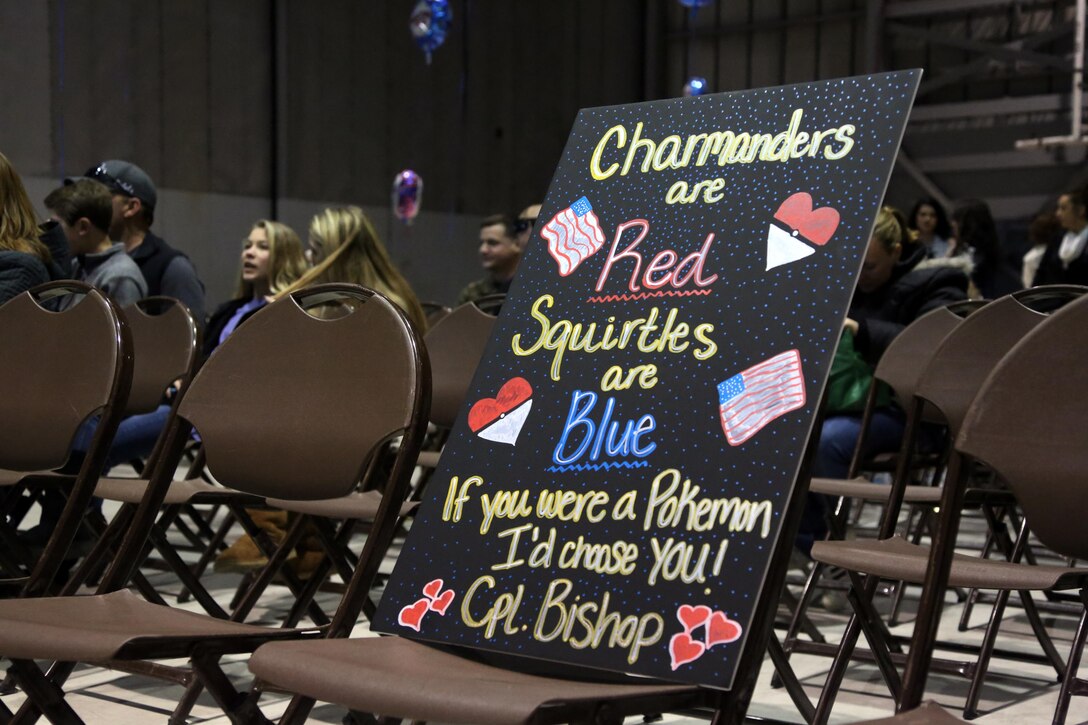 A welcome home sign is proped against a chair during a homecoming ceremony at Marine Corps Air Station Cherry Point, N.C., Feb. 11, 2016. Marines and Sailors with Marine Tactical Electronic Warfare Squadron 3 returned to the air station after a six-month deployment in support of the United States Pacific Command combatant commander, Marine Aircraft Group 12, 1st Marine Aircraft Wing with EA-6B expeditionary electronic warfare capabilities. (U.S. Marine Corps photo by Cpl. N.W. Huertas/Released)
