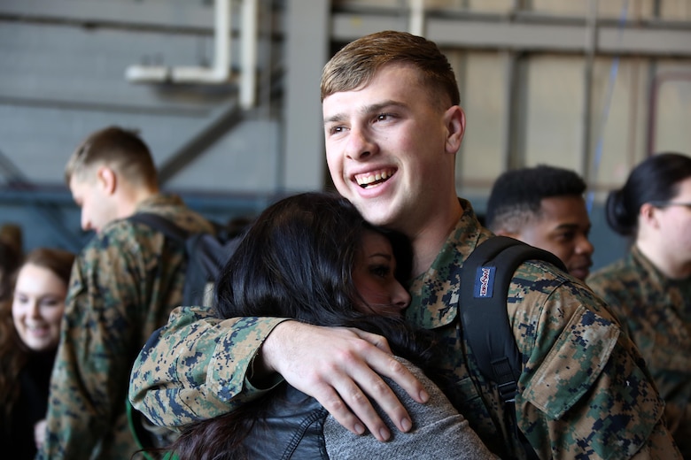 Abigail Rudolph, left, embraces Lance Cpl. Trenten Rudolph during a homecoming ceremony at Marine Corps Air Station Cherry Point, N.C., Feb. 11, 2016. Marines and Sailors with Marine Tactical Electronic Warfare Squadron 3 returned to the air station after a six-month deployment in support of the United States Pacific Command combatant commander, Marine Aircraft Group 12, 1st Marine Aircraft Wing with EA-6B expeditionary electronic warfare capabilities. (U.S. Marine Corps photo by Cpl. N.W. Huertas/Released)