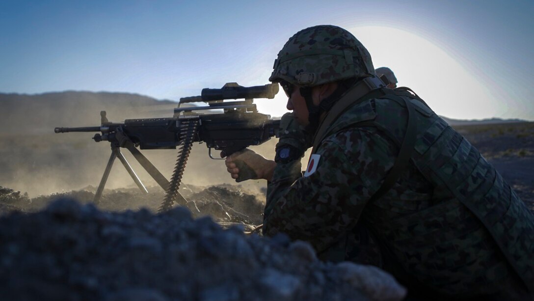 A machine gunner assigned to the Western Army Infantry Regiment, Japan Ground Self Defense Force, fires a M249 squad automatic weapon during Exercise Iron Fist 2016, aboard Marine Corps Air Ground Combat Center Twentynine Palms, Calif., Feb. 9, 2016. Iron Fist is an annual, bi-lateral training exercise between the Japan Ground Self Defense Force and Marines to strengthen warfighting capabilities in ship to shore operations.