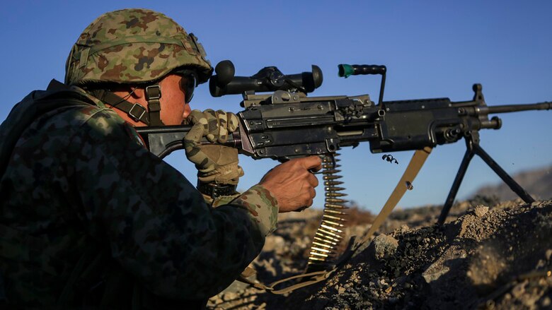 A machine gunner assigned to the Western Army Infantry Regiment, Japan Ground Self Defense Force, fires a M249 squad automatic weapon during Exercise Iron Fist 2016, aboard Marine Corps Air Ground Combat Center Twentynine Palms, Calif., Feb. 9, 2016. Iron Fist is an annual, bi-lateral training exercise between the Japan Ground Self Defense Force and Marines to strengthen warfighting capabilities in ship to shore operations.