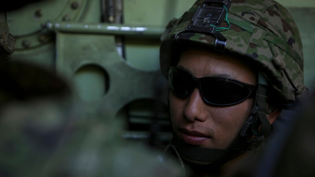 Sergeant Hatsumura Shoutarou, a rifleman with 3rd Company, Western Army Infantry Regiment, Japan Ground Self Defense Force, prepares to dismount an amphibious assault vehicle to conduct a live-fire platoon level assault during Exercise Iron Fist 2016, at Marine Corps Air Ground Combat Center Twentynine Palms, Feb. 9, 2016. Iron Fist is an annual, bi-lateral training exercise between the Japan Ground Self Defense Force and Marines to strengthen warfighting capabilities in ship to shore operations.