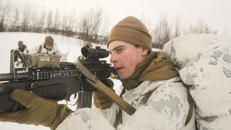 Lance Cpl. Evan George, a mortarman with Black Sea Rotational Force, sights in while conducting a routine patrol providing security for his squad during the final exercise of cold-weather training aboard Porsangmoen, Norway, Feb. 16-20, 2016. Arctic training was conducted by U.K. Royal Marine Commando Mountain Leaders and hosted by the Norwegian military to improve the U.S. Marine Corps’ capability to support their NATO Allies in extreme environments. 
