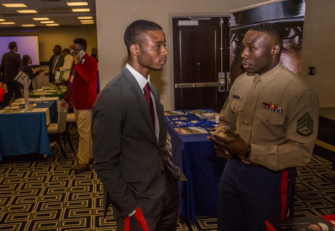 Staff Sgt. Devon McIntyre (right), officer selection assistant with the 6th Marine Corps Recruiting District, Recruiting Station Baton Rouge, speaks to a college student during a Career Readiness Day function at the Hyatt Regency Hotel in New Orleans, Feb. 19, 2016. The CRD took place in conjunction with the United Negro College Fund National Alumni and National Pre-Alumni Council Leadership Conference. The CRD provides college students with sessions, workshops and job offers with select organizations including the Marine Corps. 