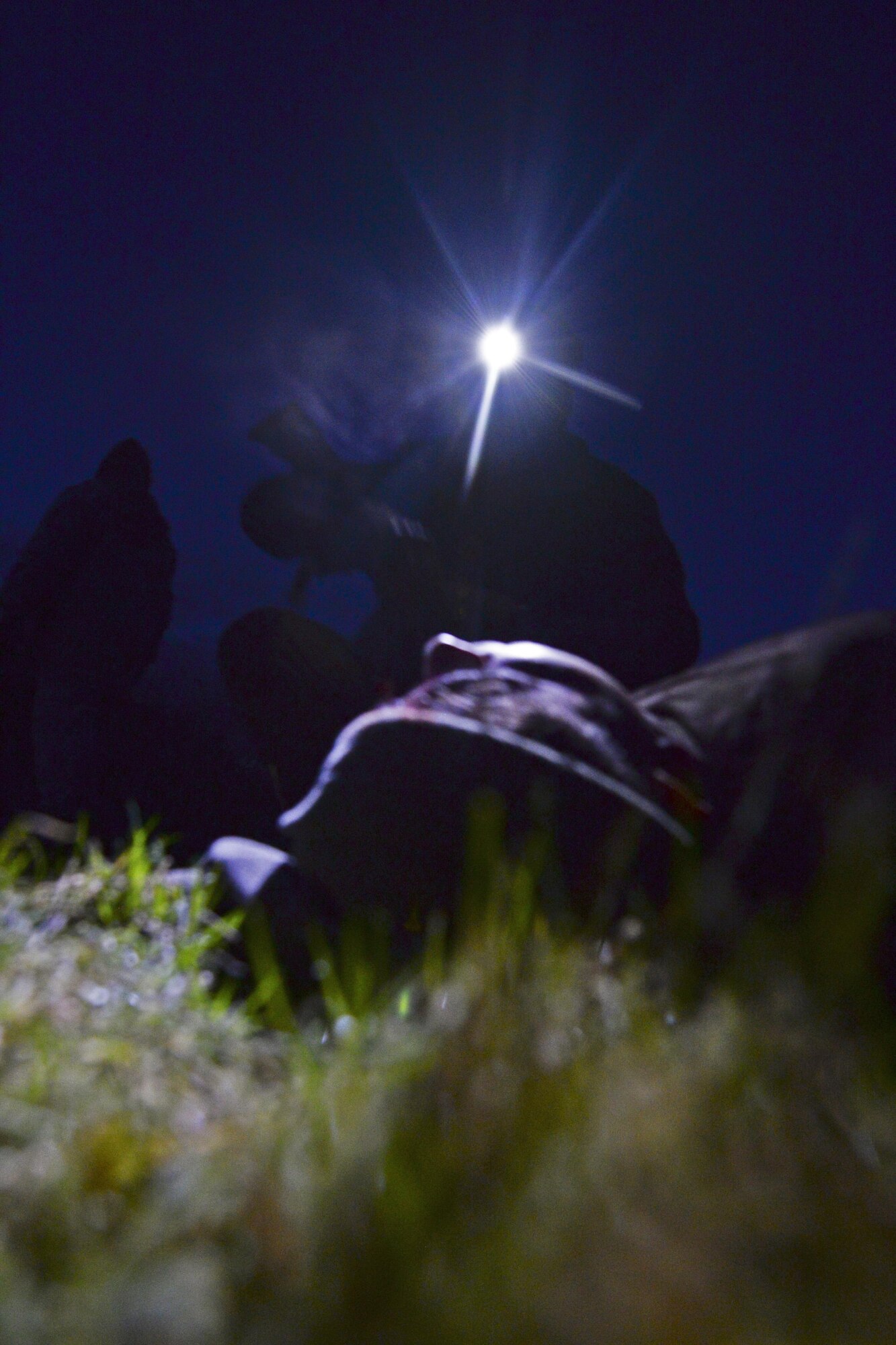 A U.S. Air Force Air Commando from the 352nd Special Operations Wing asks a simulated patient questions Feb. 11, 2016, during a routine training mission at RAF Sculthorpe in Norwich, England. During the mission, Air Commandos searched for simulated potential threats and rescued simulated injured personnel in the training area. (U.S. Air Force photo by Staff Sgt. Micaiah Anthony/Released)