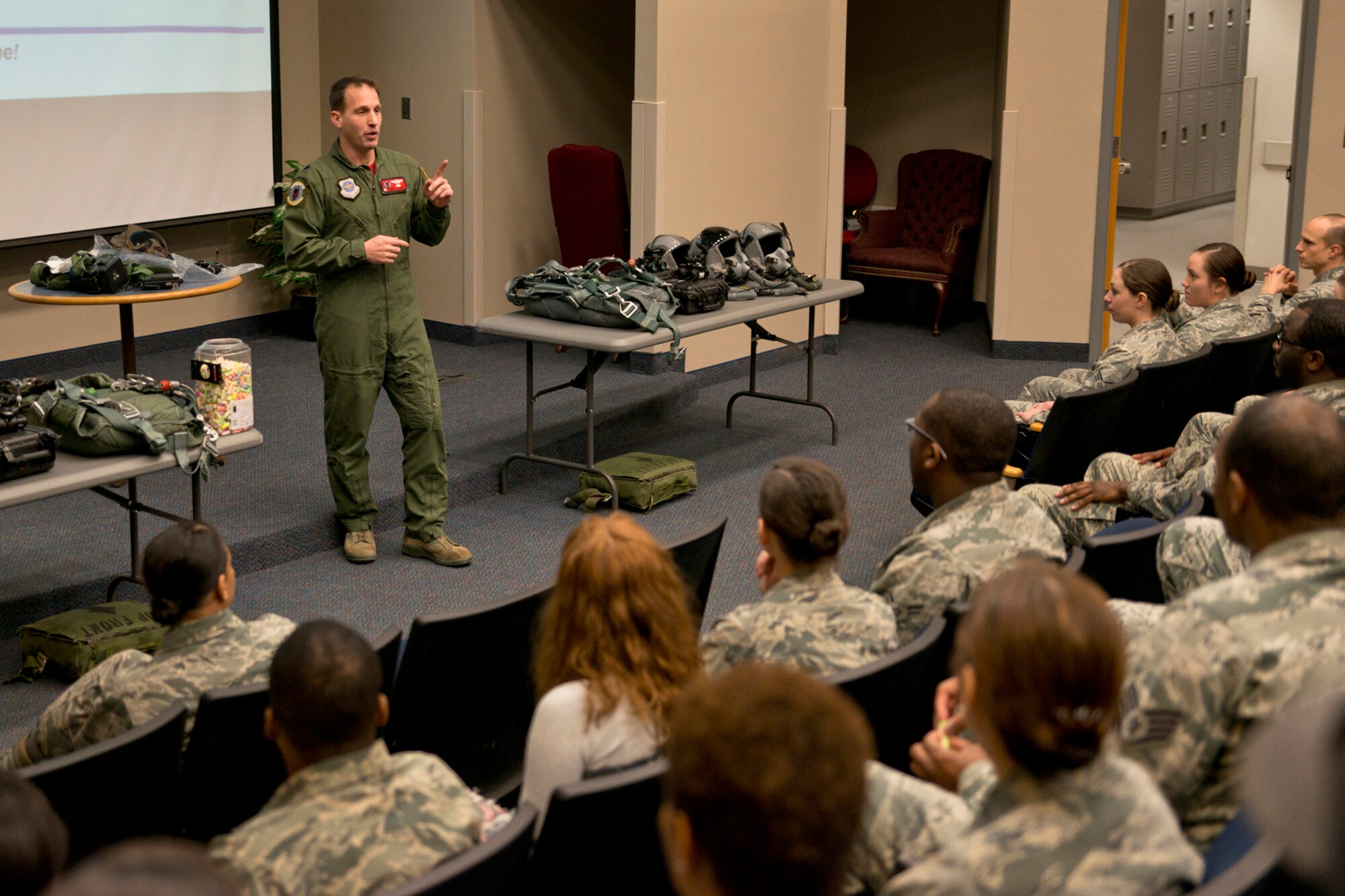 U.S. Air Force Lt. Col. James C. O’Brien III, 50th Airlift Squadron commander, addresses a group of Airmen from the 19th and 913th Force Support Squadrons during a C-130 mission immersion tour at Little Rock Air Force Base, Ark., Feb. 19, 2016. O’Brien hosted the event to show the FSS Airmen how important they are to C-130 mission at Little Rock. (U.S. Air Force photo by Master Sgt. Jeff Walston/Released)   
