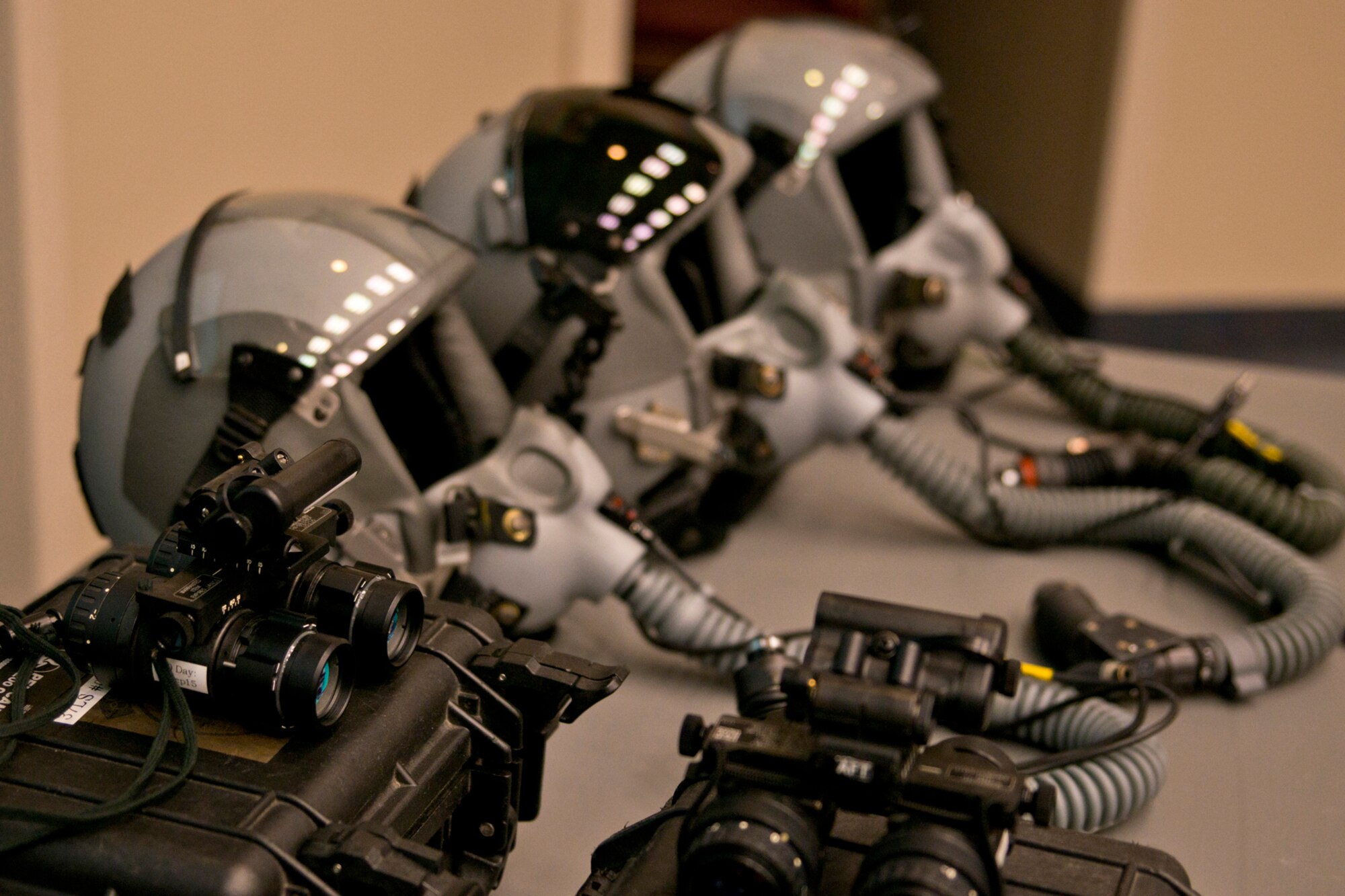Night vision equipment and helmets used by C-130 aircrews are stacked and ready for attendees of a C-130 mission immersion tour at Little Rock Air Force Base, Ark., Feb. 19, 2016. Night vision equipment allows C-130 pilots of the ability to operate in a wide range of missions, or land almost anywhere in the world, both day and night. (U.S. Air Force photo by Master Sgt. Jeff Walston/Released)   