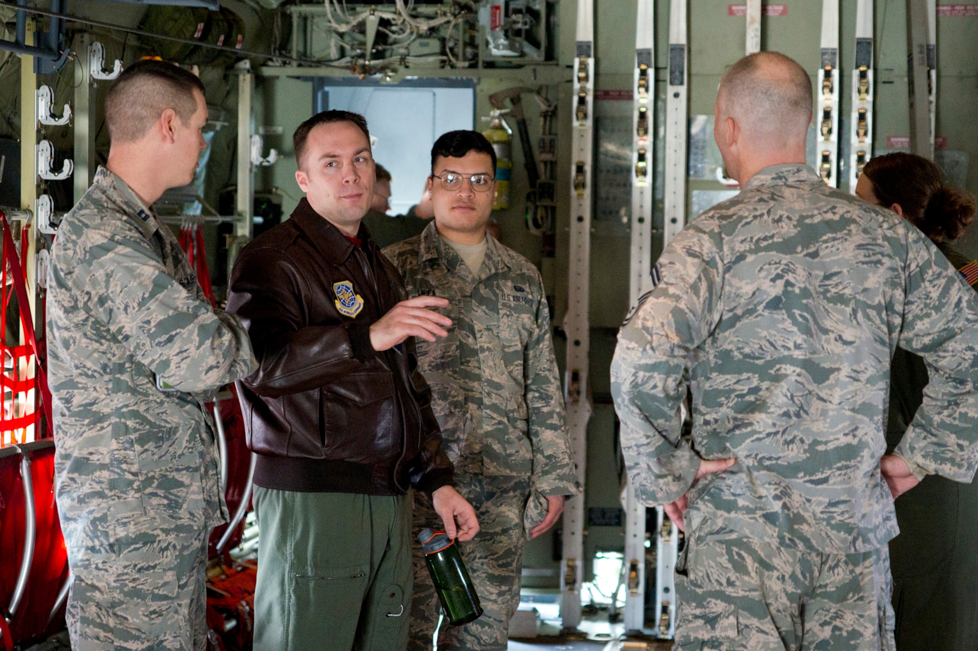 U.S. Air Force Master Sgt. Kevin Cruz, a loadmaster assigned to the 50th Airlift Squadron, explains how to load pallets on a C-130J Super Hercules during a mission immersion tour for roughly 30 Airmen from the 19th and 913th Force Support Squadrons at Little Rock Air Force Base, Ark., Feb. 19, 2016. The morning at the event was held to show FSS members, whose primary function is personnel support, how their efforts support the C-130 mission. (U.S. Air Force photo by Master Sgt. Jeff Walston/Released)   
